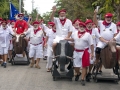 Ernest Hemingway look-alikes walk with fake bulls during the "Running of the Bulls" Saturday, July 21, 2018, in Key West, Fla. Held on the 119th anniversary of Hemingway’s birth, the whimsical take-off on the famed run in Pamplona, Spain, was a facet of the island city's annual Hemingway Days festival that ends Sunday, July 22. Hemingway lived and wrote in Key West throughout most of the 1930s. FOR EDITORIAL USE ONLY (Andy Newman /Florida Keys News Bureau/HO)