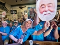 Celebrity chef Paula Deen waves a large photo of her husband Michael Groover while he competes in the Hemingway Look-Alike Contest Saturday, July 21, 2018, at Sloppy Joe's Bar in Key West, Fla. Groover won the contest on his ninth attempt. The competition attracted 151 contestants who were judged on their resemblance to the late author, personality and other variables. Ernest Hemingway lived and wrote in Key West throughout most of the 1930s. FOR EDITORIAL USE ONLY (Andy Newman/Florida Keys News Bureau/HO)
