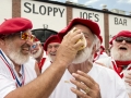 Dave Hemingway, left, smears birthday cake on Richard Filip after he and fellow Ernest Hemingway look-alikes sang "Happy Birthday" to the famed American author Saturday, July 21, 2018, in Key West, Fla. Dave Hemingway (no relation to the author) won the 2016 Hemingway Look-Alike Contest and Filip was victorious in 2017. July 21 marks the 119th birthday anniversary of Hemingway, who lived and wrote on the island during the 1930s. The fun was a facet of Key West's annual Hemingway Days festival that concludes Sunday, July 22. FOR EDITORIAL USE ONLY (Andy Newman /Florida Keys News Bureau/HO)