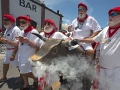 Ernest Hemingway look-alikes push a fake bull with smoke emanating from its nostrils during the “Running of the Bulls” Saturday, July 24, 2021, in Key West, Fla. A spoof of the event’s namesake in Pamplona, Spain, the subtropical island city’s version features fake bulls on wheels and is part of the annual Hemingway Days festival that honors author Ernest Hemingway, who lived and wrote in Key West throughout most of the 1930s. FOR EDITORIAL USE ONLY (Andy Newman/Florida Keys News Bureau/HO)