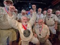Joe Maxey, second from left, celebrates his victory at the Hemingway Look-Alike Contest Saturday, July 20, 2019,at Sloppy Joe's Bar in Key West, Fla. Competing for the eighth time, Maxey beat 141 other contestants to claim top honors. The competition highlighted activities during the yearly Hemingway Days festival that honors author Ernest Hemingway who lived in Key West during the 1930s. FOR EDITORIAL USE ONLY (Andy Newman/Florida Keys News Bureau/HO)