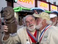 Joe Maxey, left, gets a playful smooch from Michael Groover, after Maxey won the Hemingway Look-Alike Contest Saturday, July 20, 2019, at Sloppy Joe's Bar in Key West, Fla. Competing for his eighth time, Maxey beat 141 other contestants to claim top honors. Groover, husband of celebrity chef Paula Deen, won the title in 2018. FOR EDITORIAL USE ONLY (Andy Newman/Florida Keys News Bureau/HO)