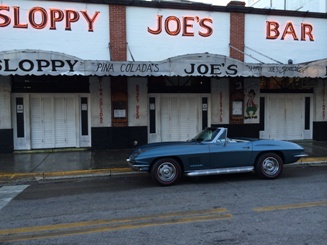 old corvette in front of sloppy joes