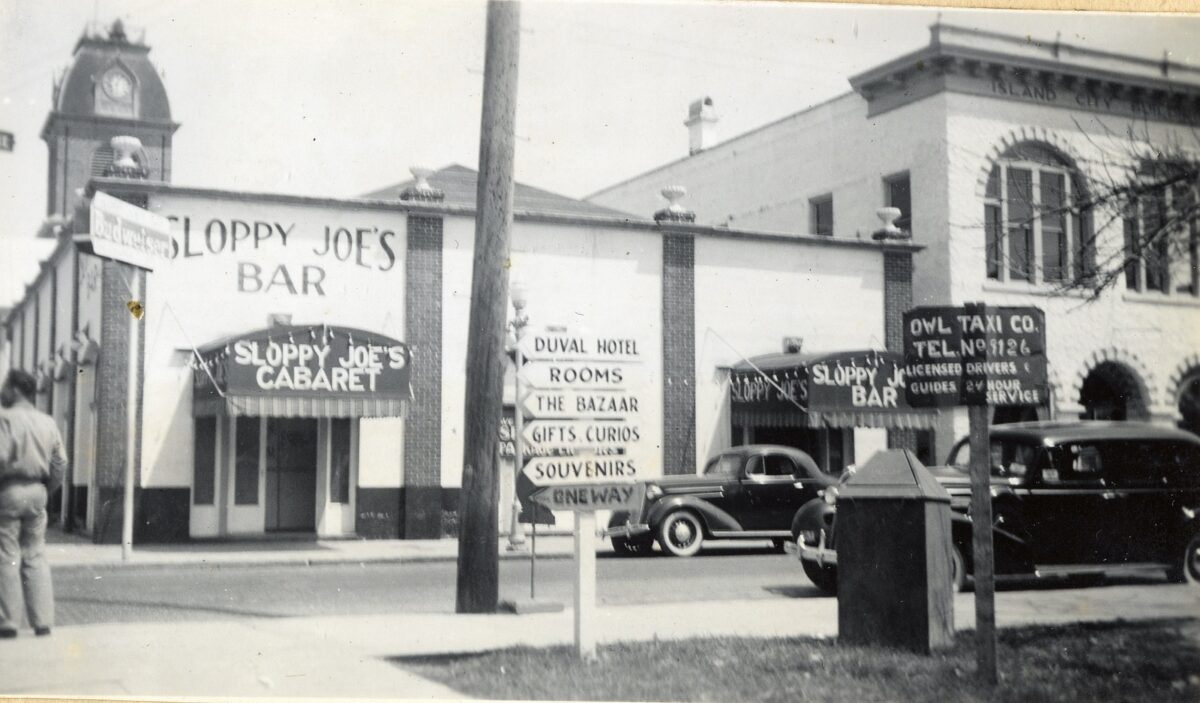 Florida keys public library - sloppy joes bar and owl taxi company at 201 duval street. From the dewolfe and wood collection in the otto hirzel scrapbook. 1940s