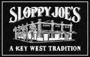 Sloppy joe's key west building logo with 'a key west tradition' on black golf towel