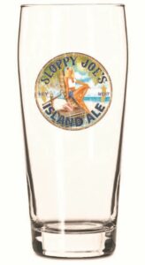 Sloppy joe's island ale pint glass featuring key west logo and pin-up art