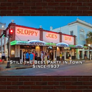 Sloppy joe's bar neon exterior at dusk, key west—crowd and tagline since 1937